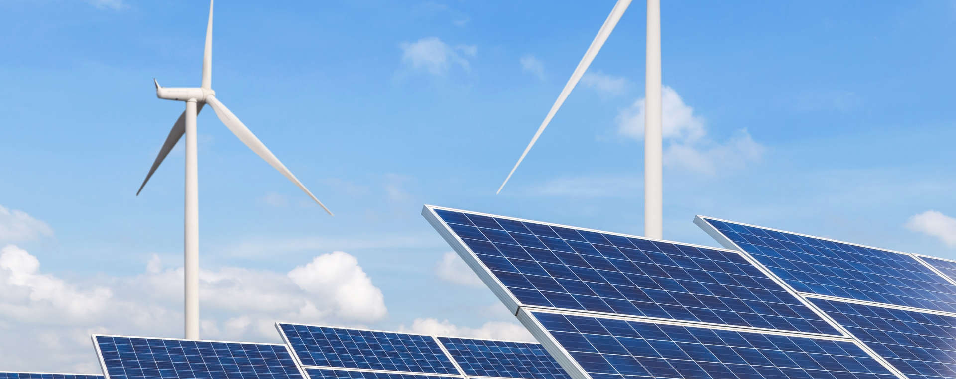 solar panels and wind turbines in power station