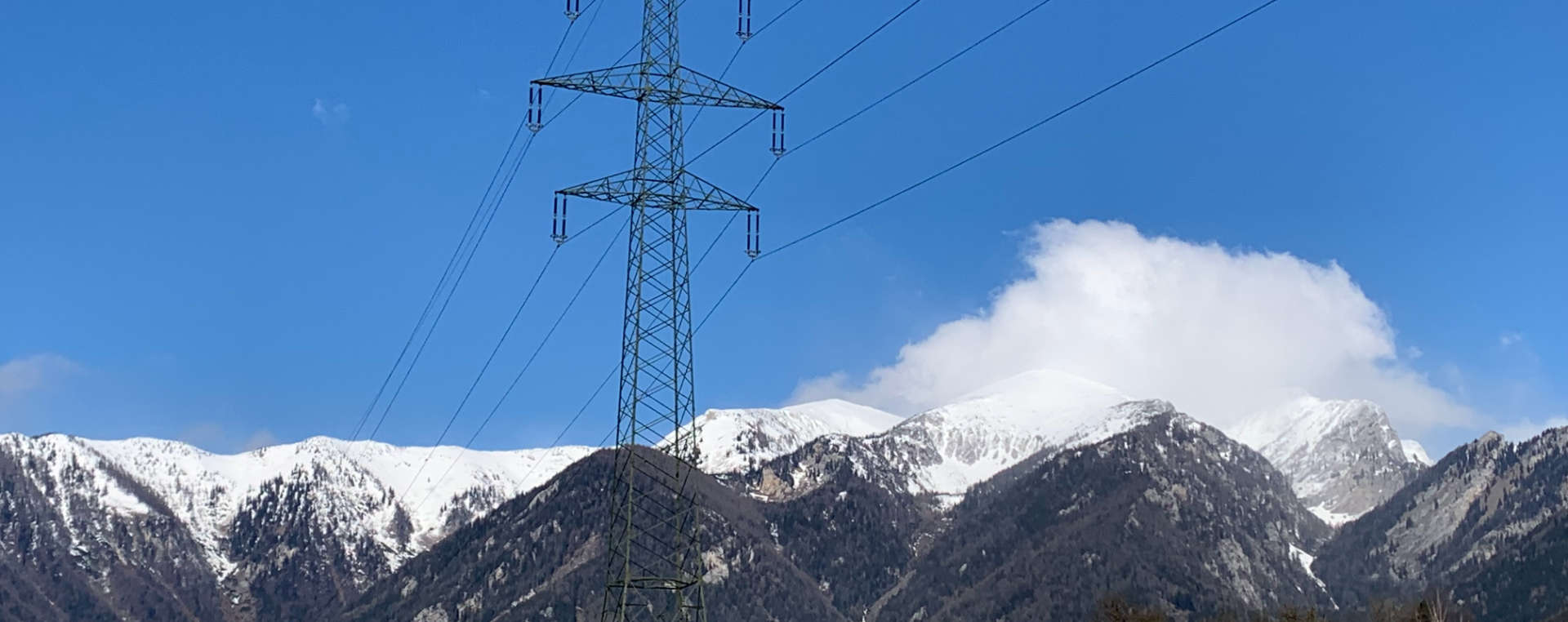 Image of a 220-kV power line with mountains in the background